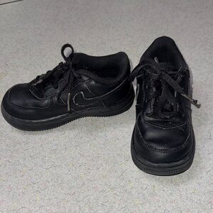 Kids black Nike Air Force 1s